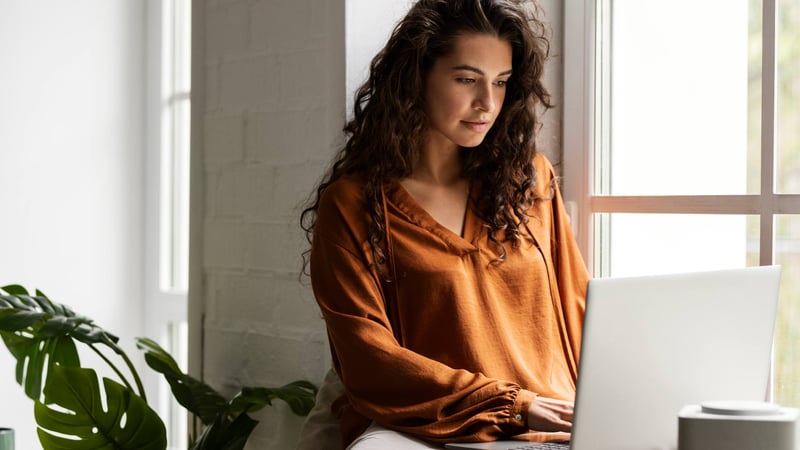 medium-shot-woman-working-laptop_web